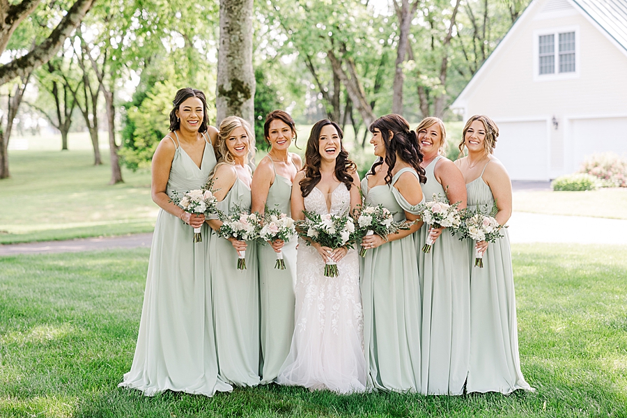 Bride laughing with bridesmaids at Marblegate Wedding by Amanda May Photos