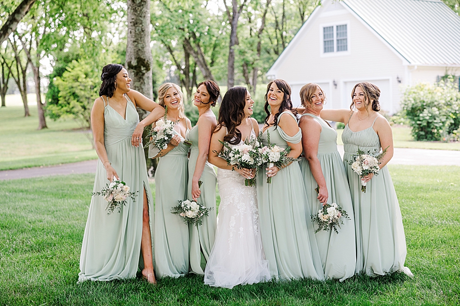 Bride and bridesmaids laughing together at Marblegate Wedding by Amanda May Photos