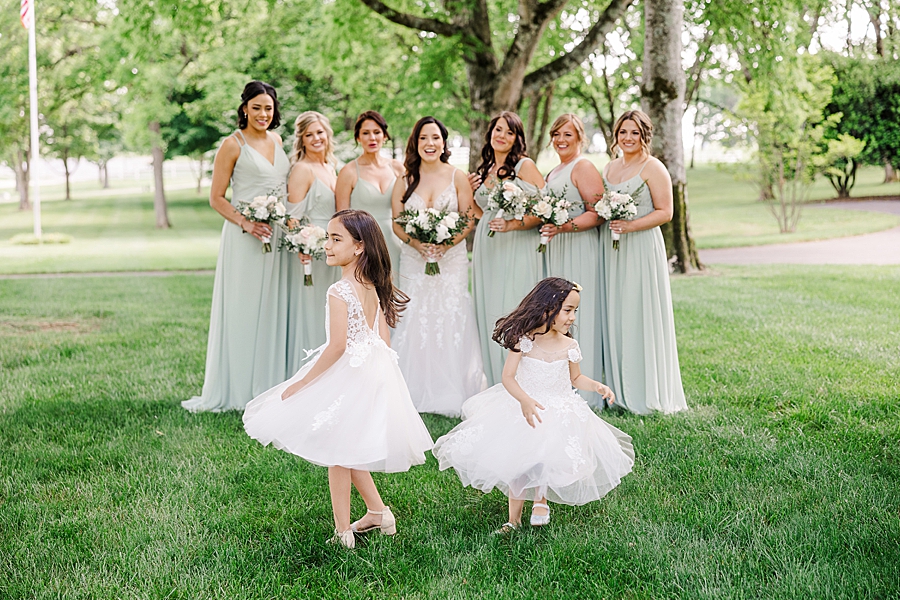 Flower girls twirling at Marblegate Wedding by Amanda May Photos