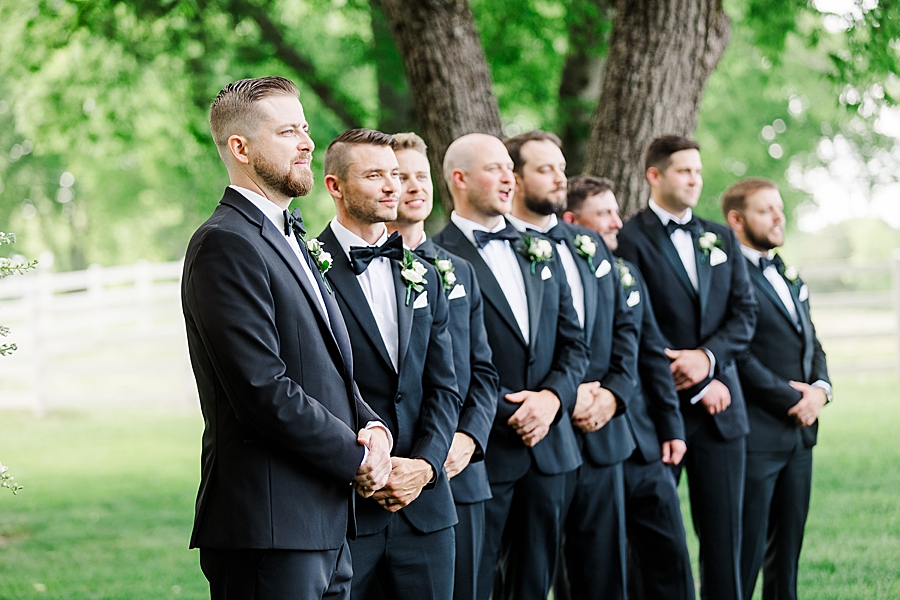 Groom and groomsmen standing at the altar at Marblegate Wedding by Amanda May Photos