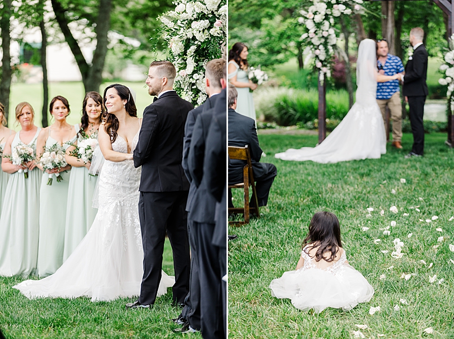 Flower girl sits in aisle at Marblegate Wedding by Amanda May Photos