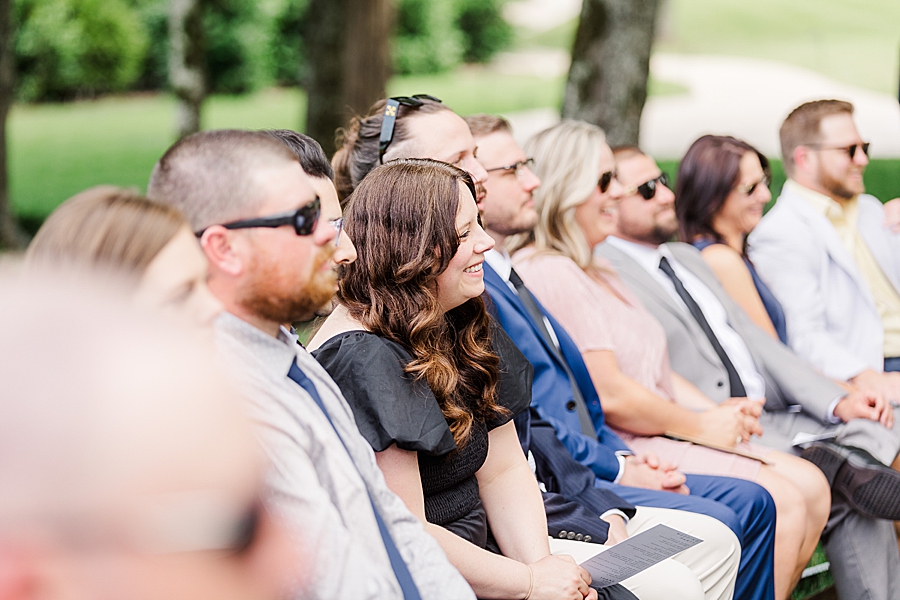 Guests laughing at Marblegate Wedding by Amanda May Photos