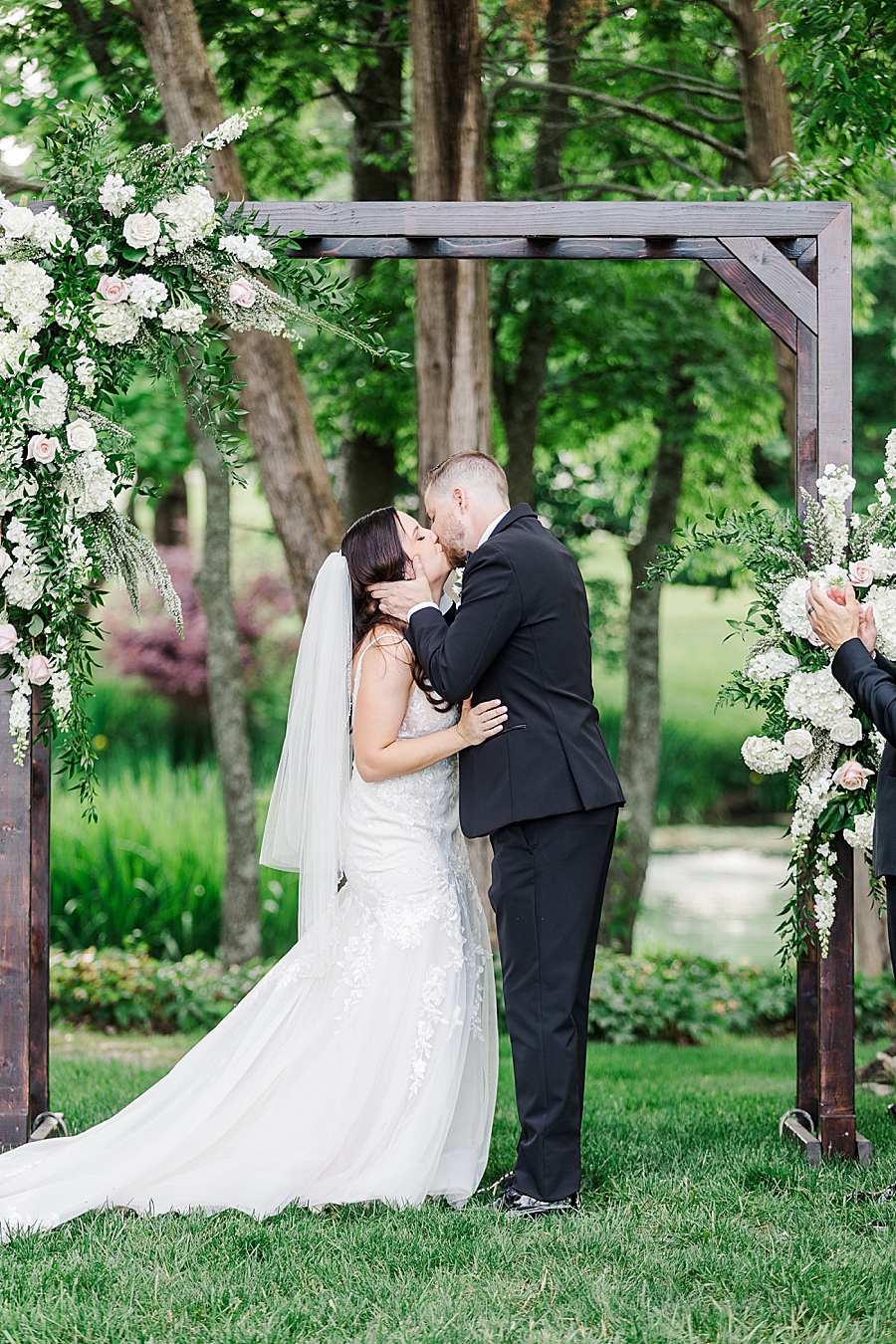 Bride and groom kissing at Marblegate Wedding by Amanda May Photos