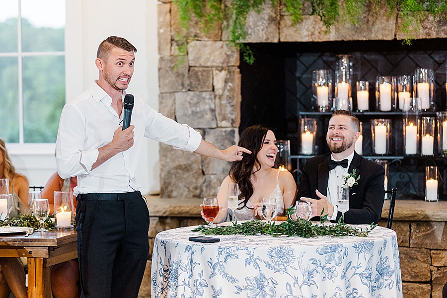 Groomsmen gives speech at wedding by Amanda May Photos