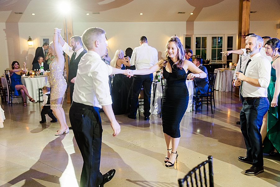 Guests dancing at wedding by Amanda May Photos