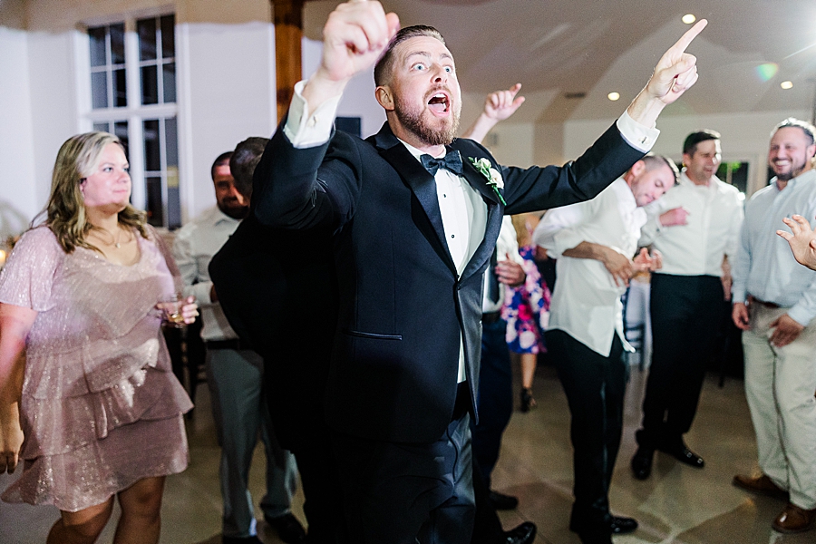 Groom dancing at wedding by Amanda May Photos