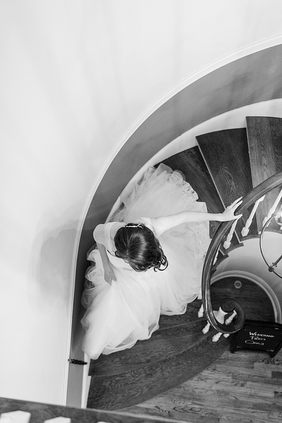 bride walkind down spiral staircase