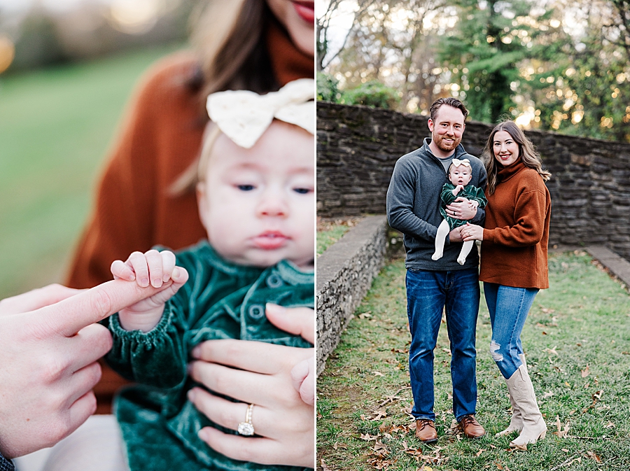 dad holding baby girl's hand