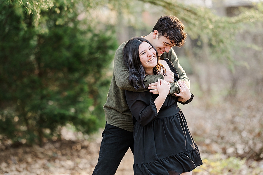 hug from behind at knoxville botanical engagement
