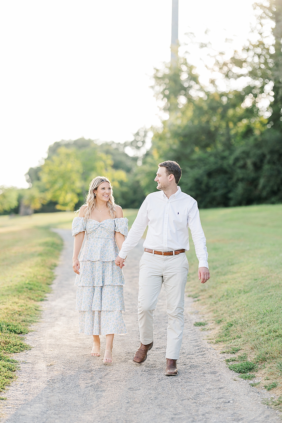 couple holding hands at knoxville botanical garden engagement