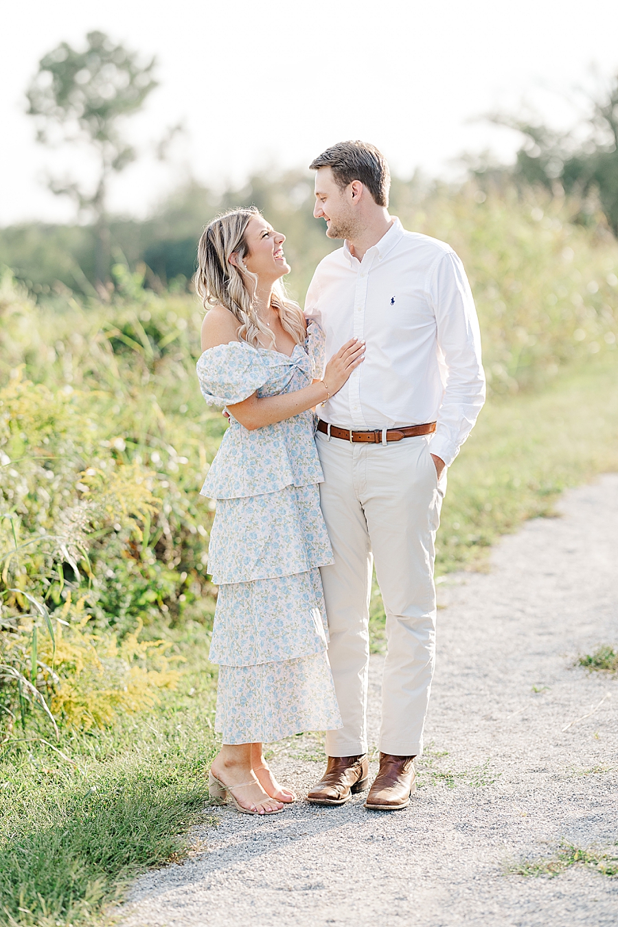 couple standing on gravel road at knoxville botanical garden engagement