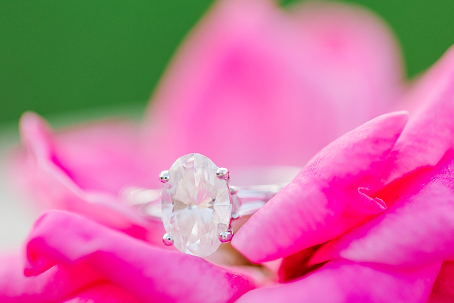 engagement ring on pink flower