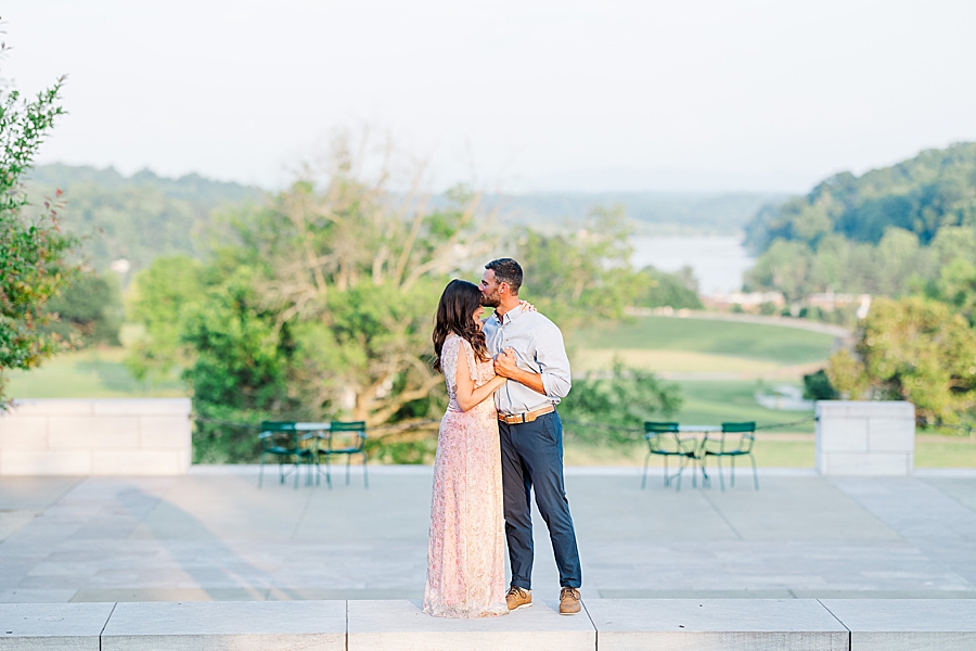 kiss on forehead at lakeshore park engagement