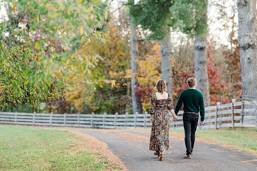 couple walking down long driveway