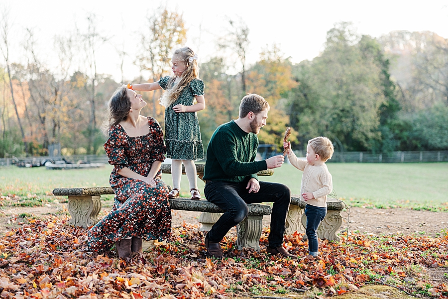 family sitting at picnic table