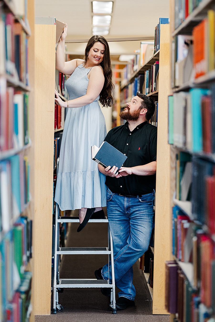 checking out books together at library engagement photos