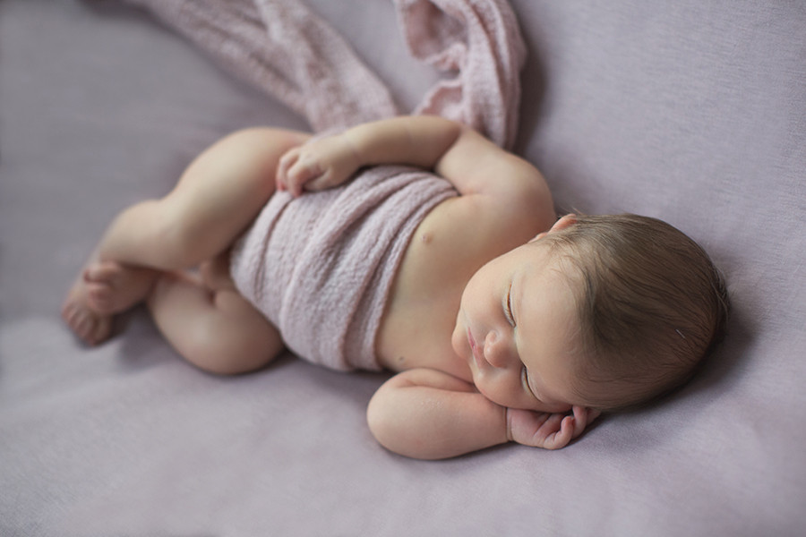 Band wrapped around her tummy at this newborn session by Knoxville Wedding Photographer, Amanda May Photos.