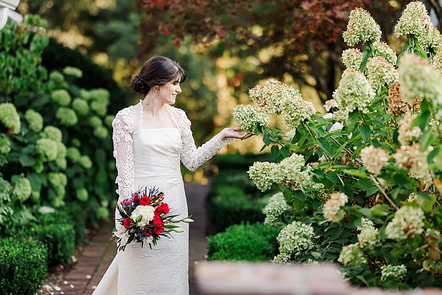 bride by hydrangea at maple grove bridal session