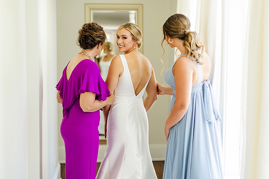 putting on dress at maple grove estate