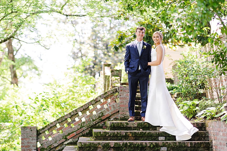 couple standing on stairs at maple grove estate