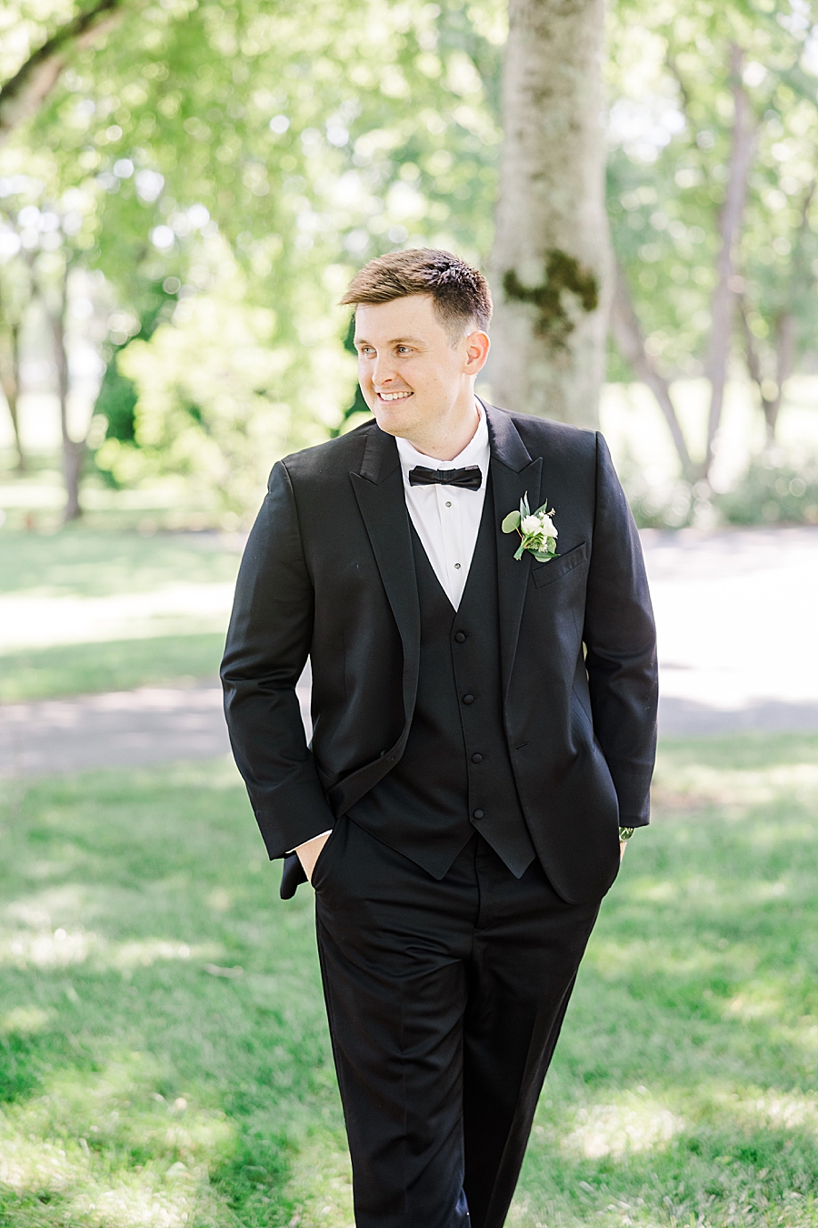 groom with hands on pockets