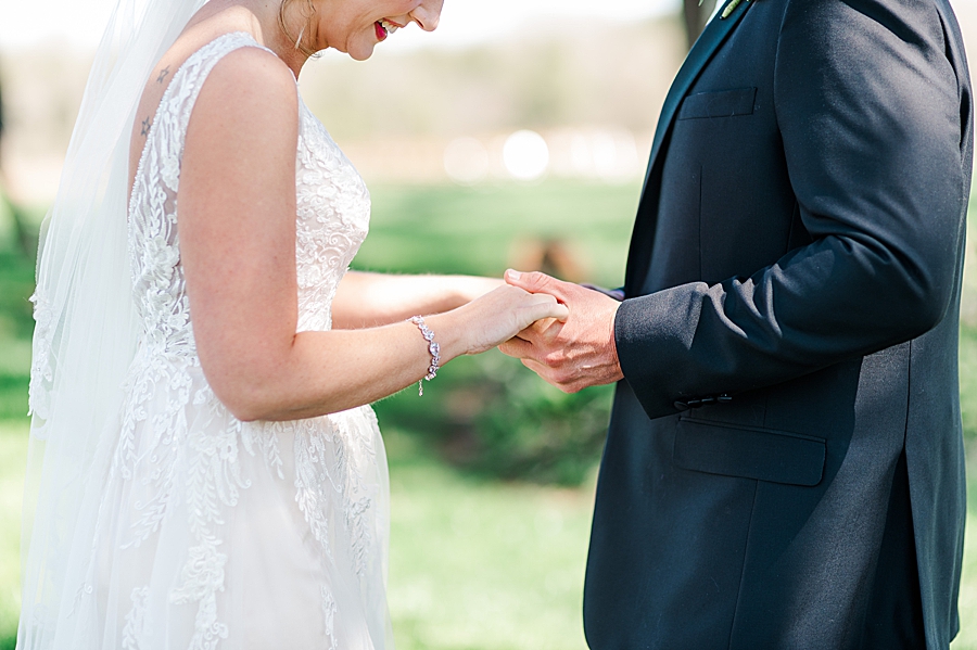 bride and groom holding hands at marblegate farm associate wedding