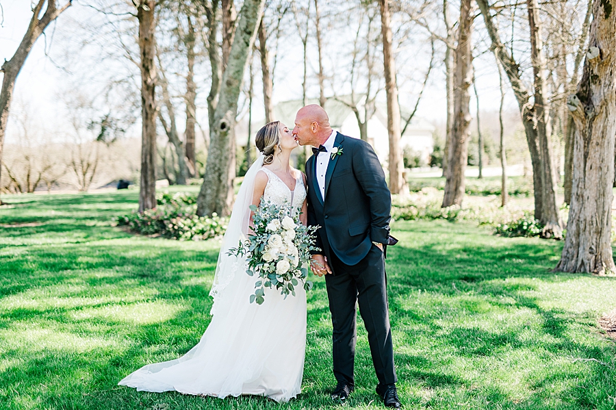 couple kissing at marblegate farm associate wedding