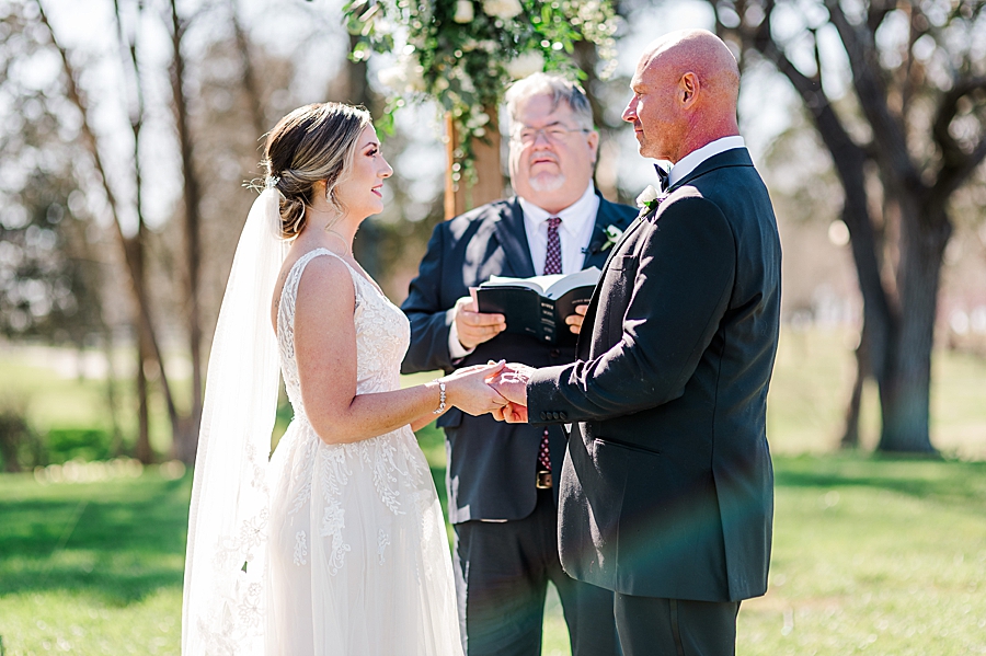 exchanging rings at marblegate farm associate wedding