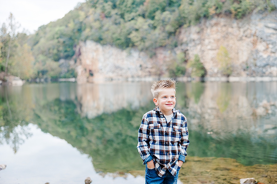boy in plaid standing by quarry