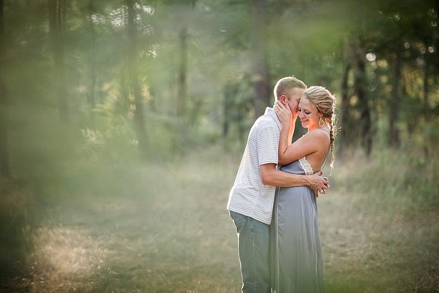 Through the trees at this Air Force Engagement Session by Knoxville Wedding Photographer, Amanda May Photos.