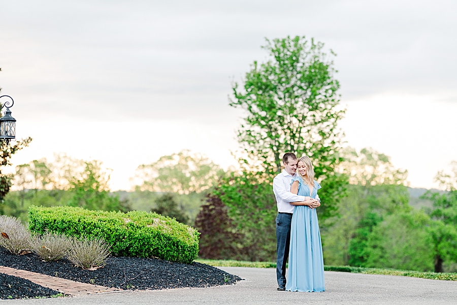 Wrapping arms around her at Castleton Engagement by Amanda May Photos