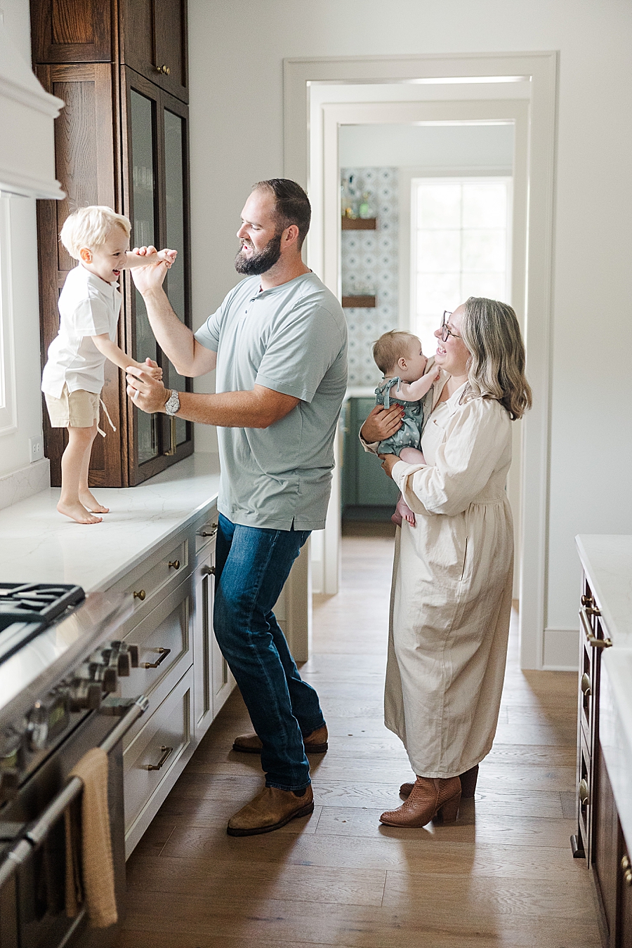 family playing in kitchen during nashville lifestyle session