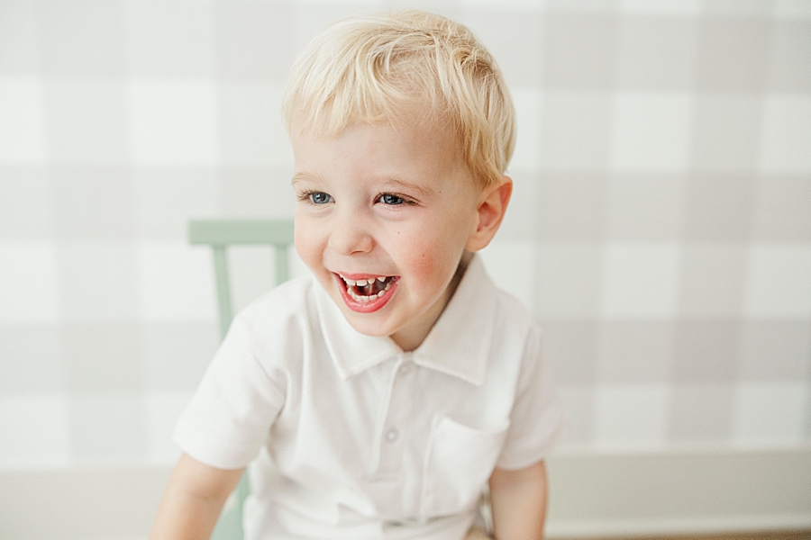 little boy on green chair