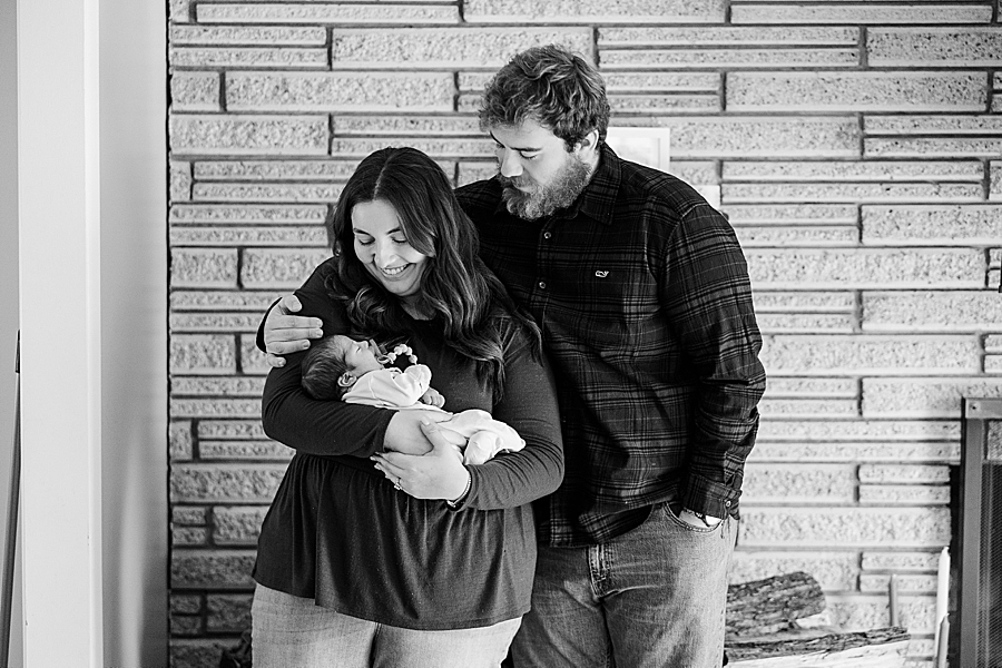 parents holding newborn son