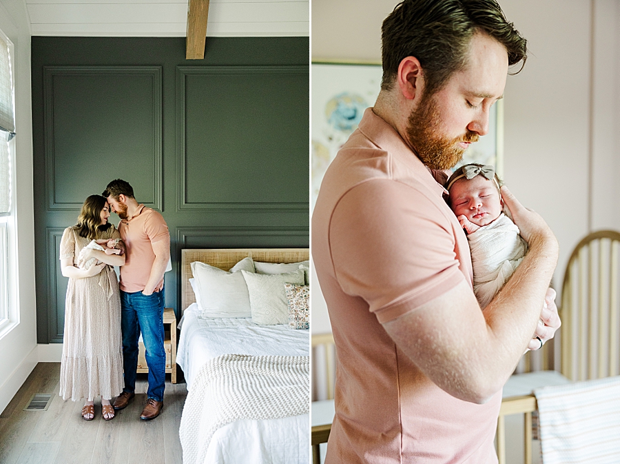 dad holding newborn daughter