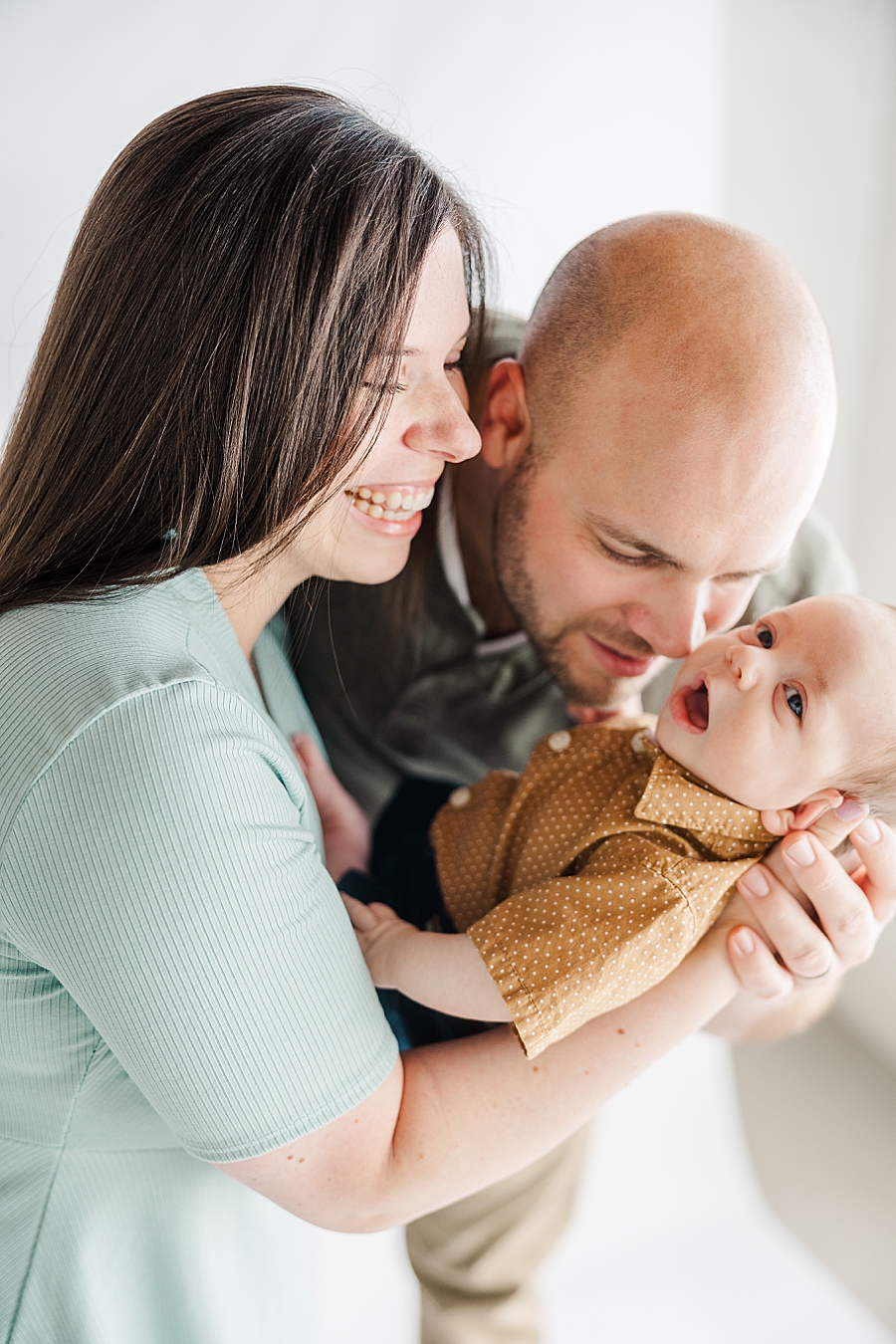 snuggling baby at newborn session at highlight studio