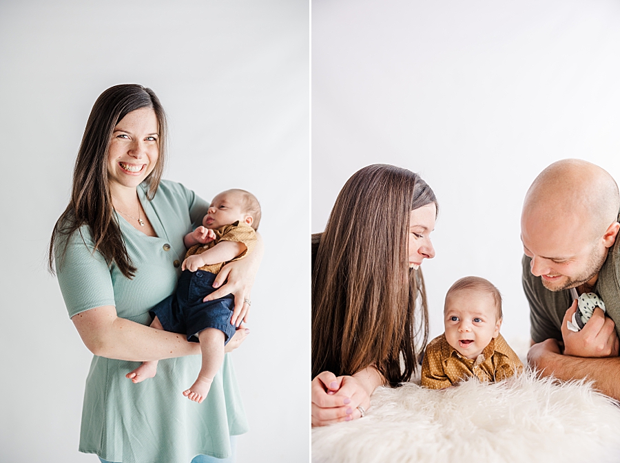 mom holding son at newborn session at highlight studio