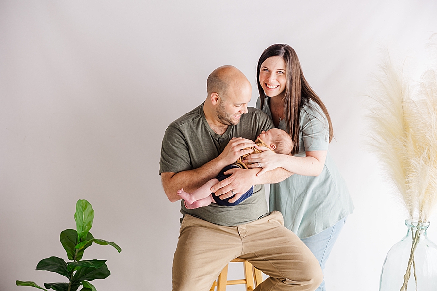 family of three at newborn session at highlight studio