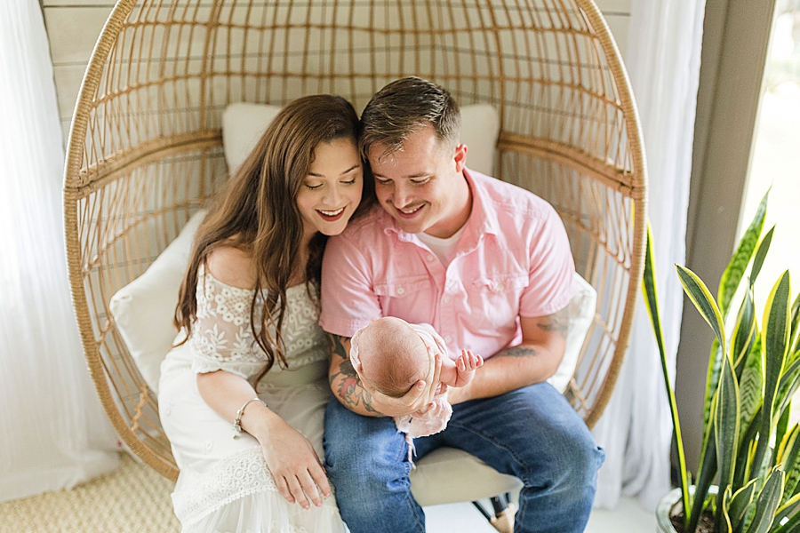 parents holding baby at this newborn session