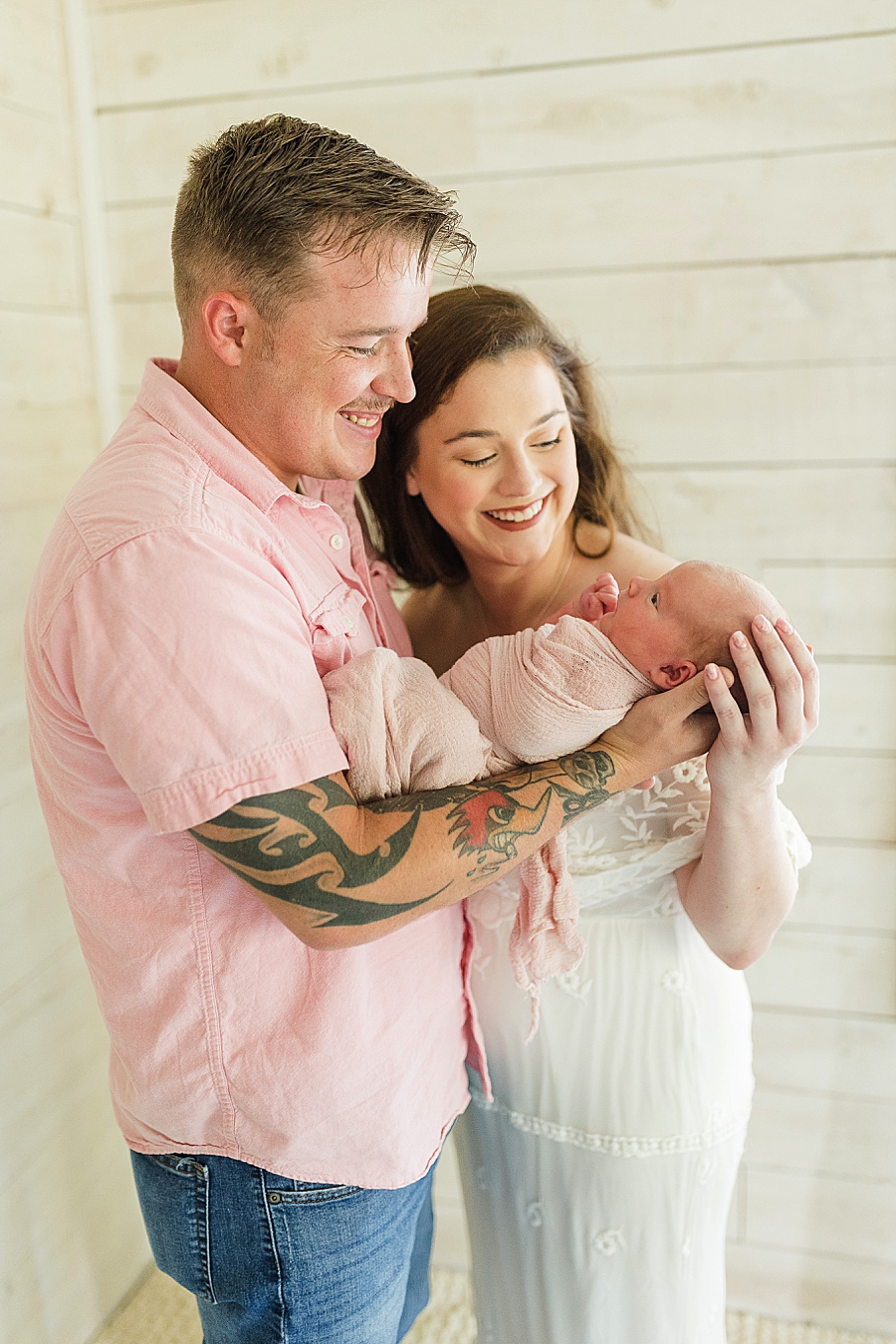 dad holding daughter at this newborn session