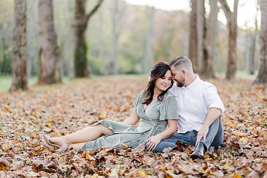 couple sitting in leaves at norris