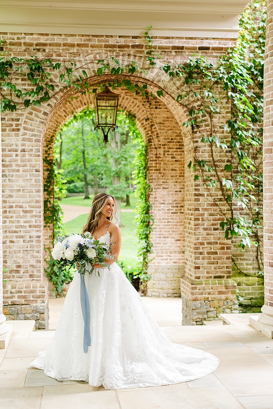 bride under brick arch at page road estate