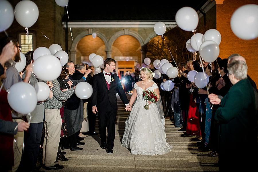 White balloons used in this unique reception exit ideas by Knoxville Wedding Photographer, Amanda May Photos.