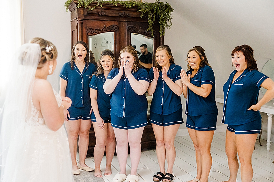 Bridesmaids react to bride at Ramble Creek wedding by Amanda May Photos