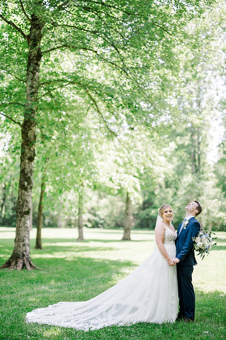 Laughing together at Ramble Creek wedding by Amanda May Photos