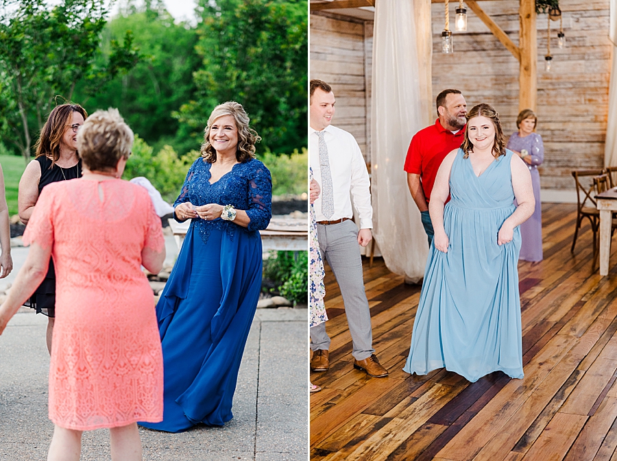 Mom smiling at guests at wedding by Amanda May Photos