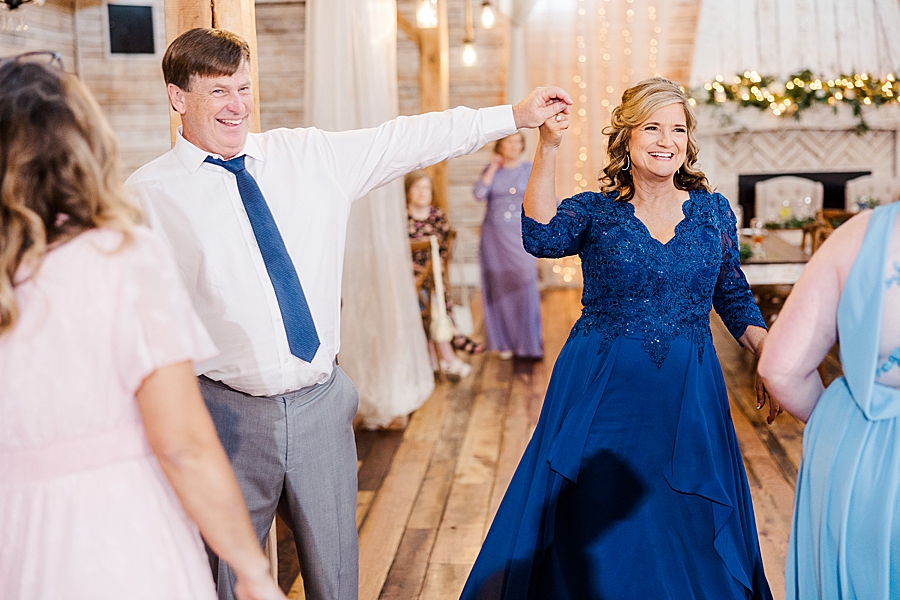 Mom and dad dancing at wedding by Amanda May Photos