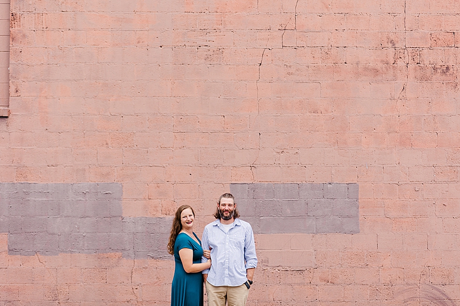 engagement photos by red wall