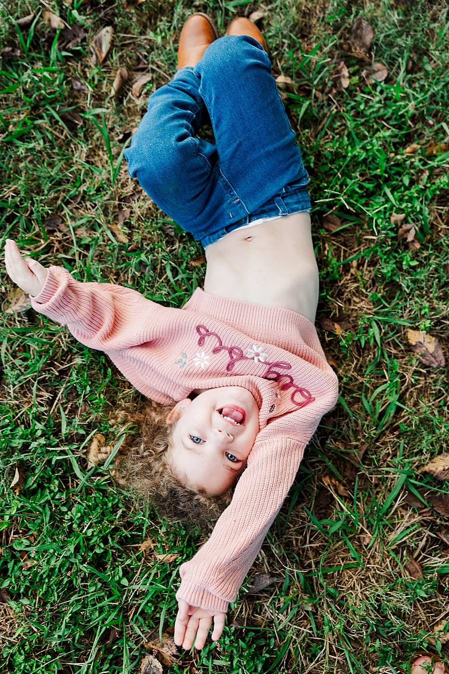 girl playing on sequoyah hills park grass