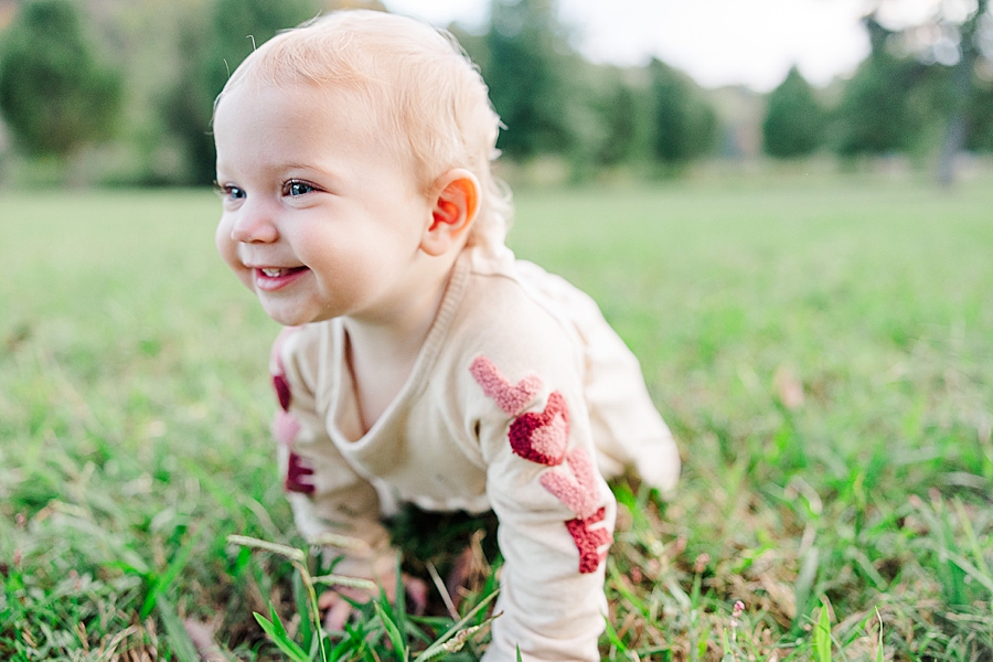 baby crawling in grass at sequoyah hills park